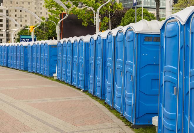 a row of portable restrooms set up for a large athletic event, allowing participants and spectators to easily take care of their needs in Amlin, OH